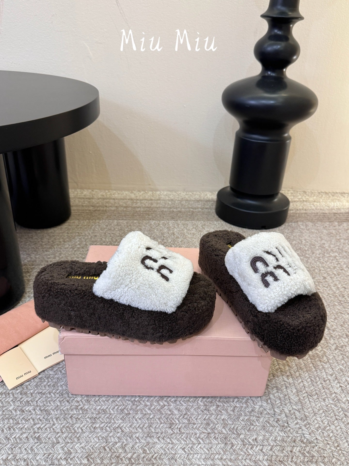 MIUMIU 26S PLATFORM SLIDES IN DARK BROWN AND WHITE SHEARLING