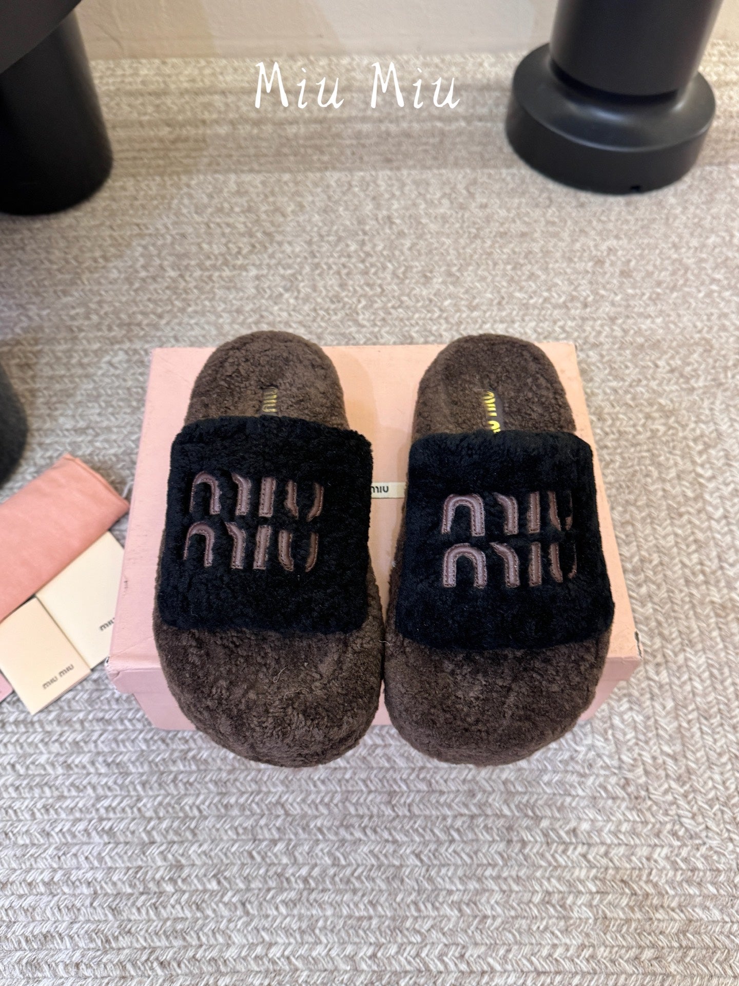 MIUMIU 26S PLATFORM SLIDES IN DARK BROWN AND BLACK SHEARLING