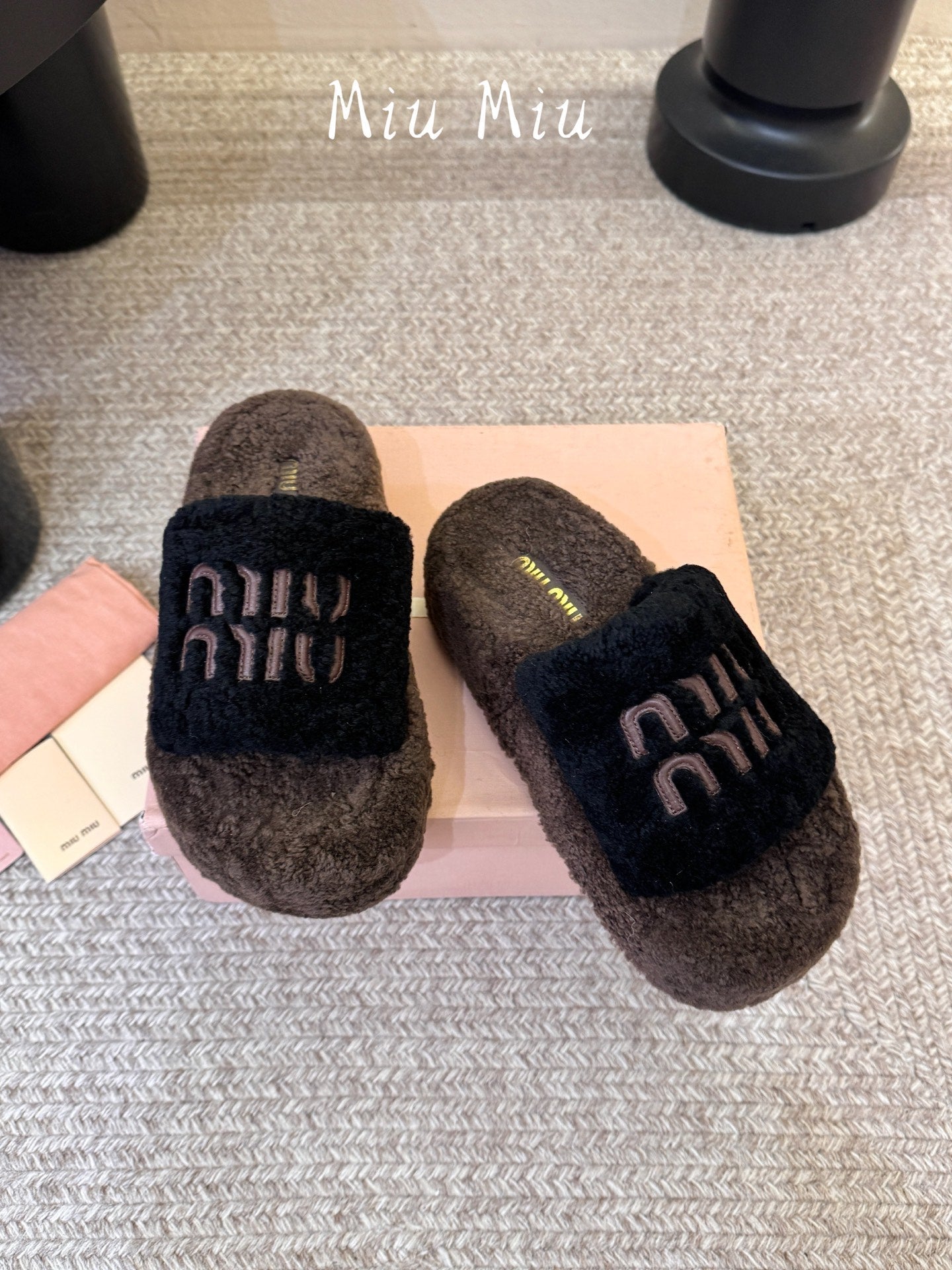 MIUMIU 26S PLATFORM SLIDES IN DARK BROWN AND BLACK SHEARLING