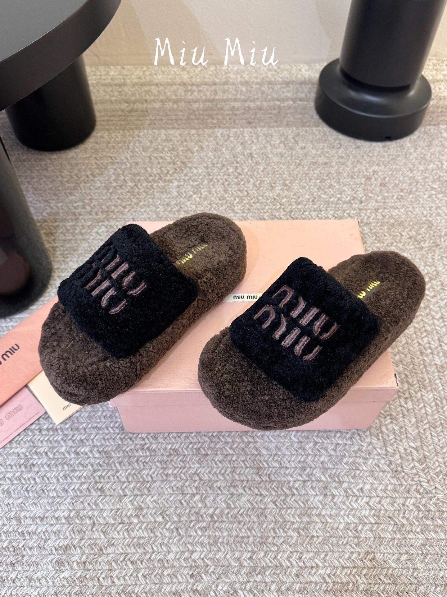 MIUMIU 26S PLATFORM SLIDES IN DARK BROWN AND BLACK SHEARLING