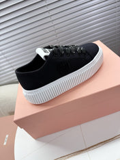 MIUMIU 26S PLATFORM SNEAKERS IN BLACK CANVAS