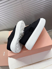 MIUMIU 26S PLATFORM SNEAKERS IN BLACK CANVAS
