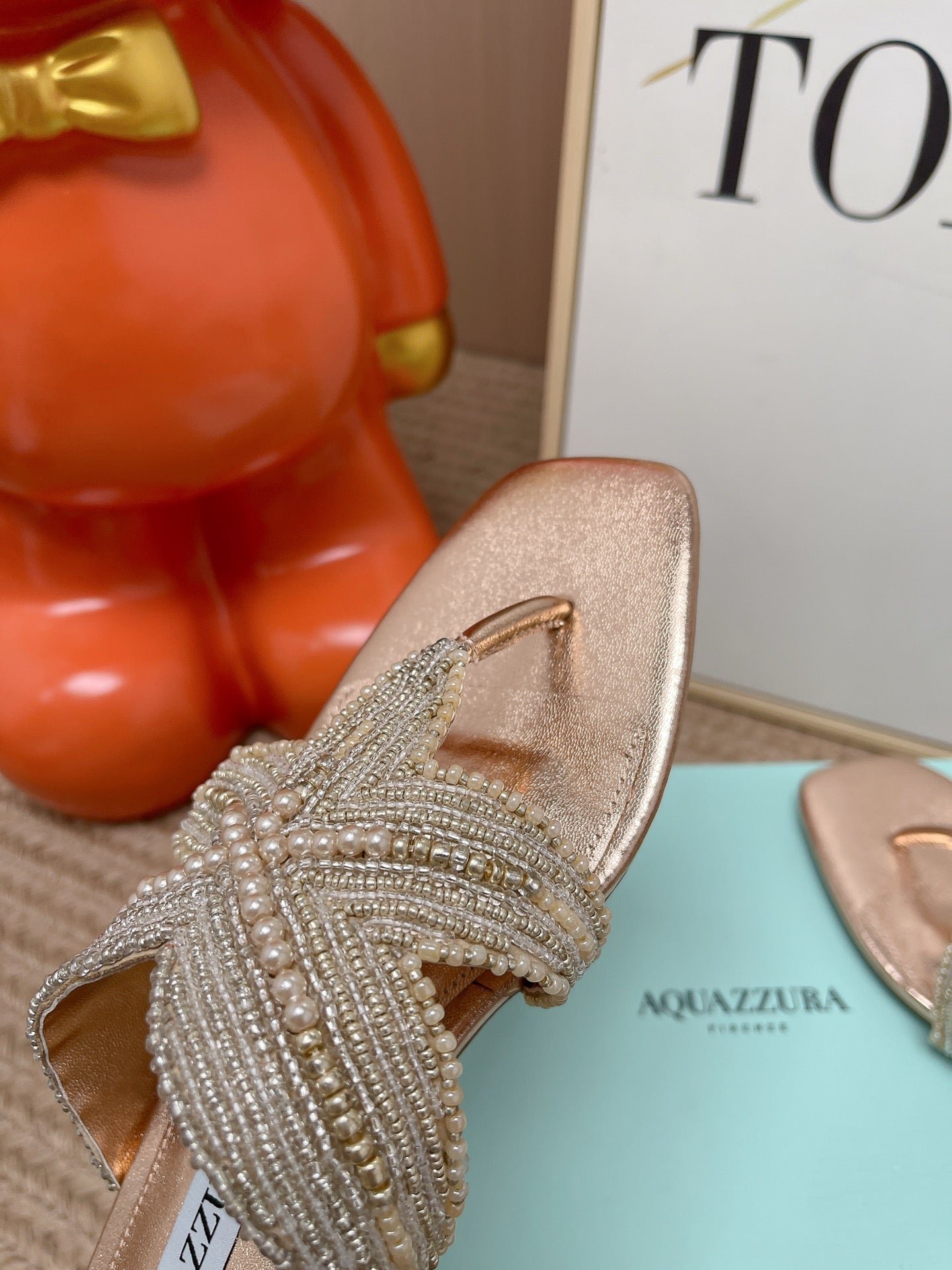 AQUAZZURA 26S STARFISH BEADED THONG SANDALS IN ROSE GOLD LAMBSKIN