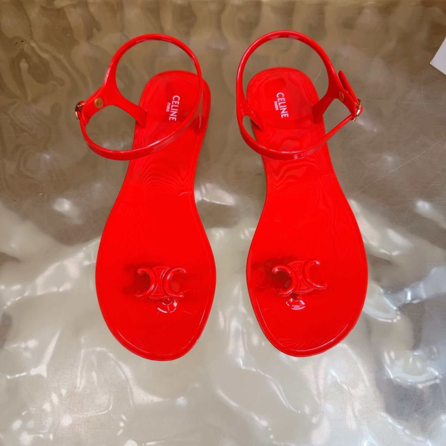 CELINE 26S TRIOMPHE JELLY THONG SANDALS IN BRIGHT RED TPU GOLD HARDWARE