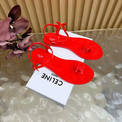 CELINE 26S TRIOMPHE JELLY THONG SANDALS IN BRIGHT RED TPU GOLD HARDWARE