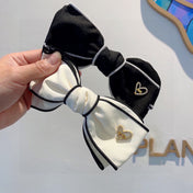 BOW HAIRPIN IN BLACK AND WHITE TRIM COTTON 406022