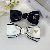 BOW HAIRPIN IN WHITE AND BLACK TRIM COTTON 406023