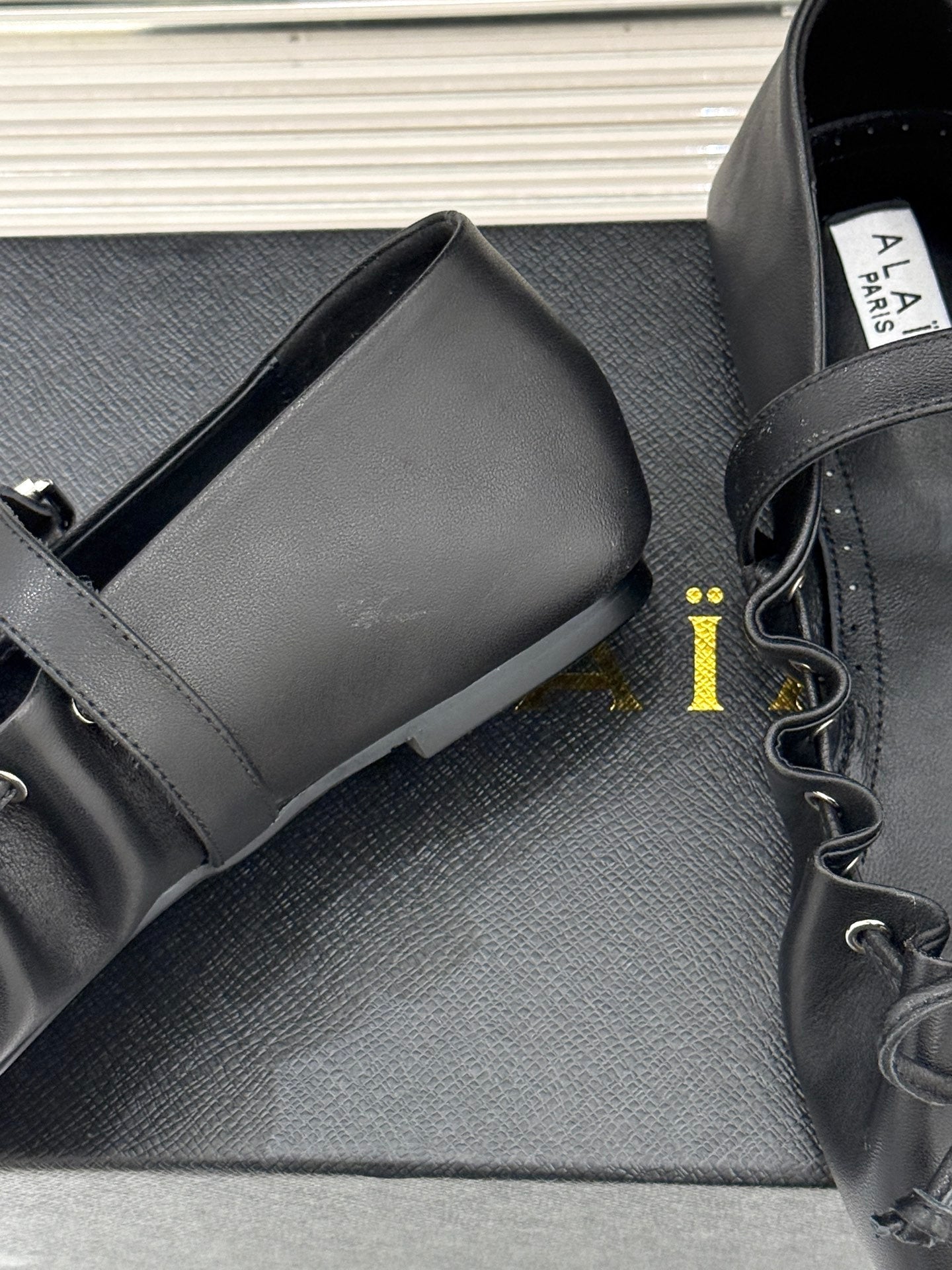 ALAIA 26S MARY JANE FLATS IN BLACK LAMBSKIN WITH BOW