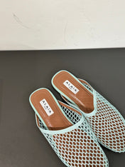 ALAIA FLAT MULES IN LIGHT BLUE MESH FISHNET