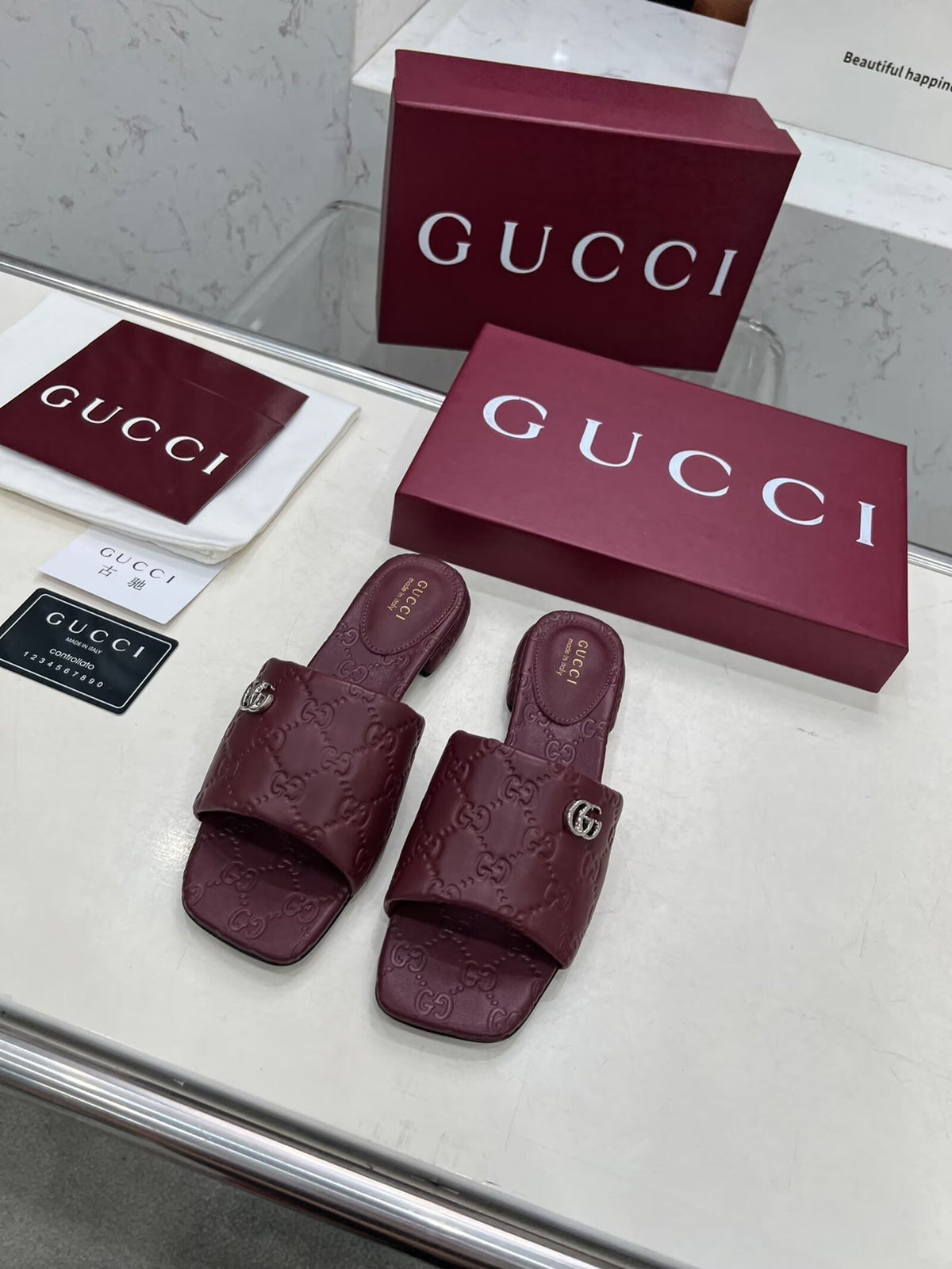 GG CASUAL SLIPPERS IN BURGUNDY RED CALFSKIN LOGO EMBOSSING