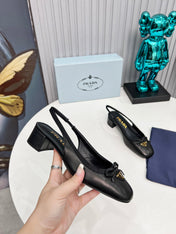 PRADA 26S ROUND TOE SLINGBACK PUMPS 40MM IN BLACK CALFSKIN WITH BOW
