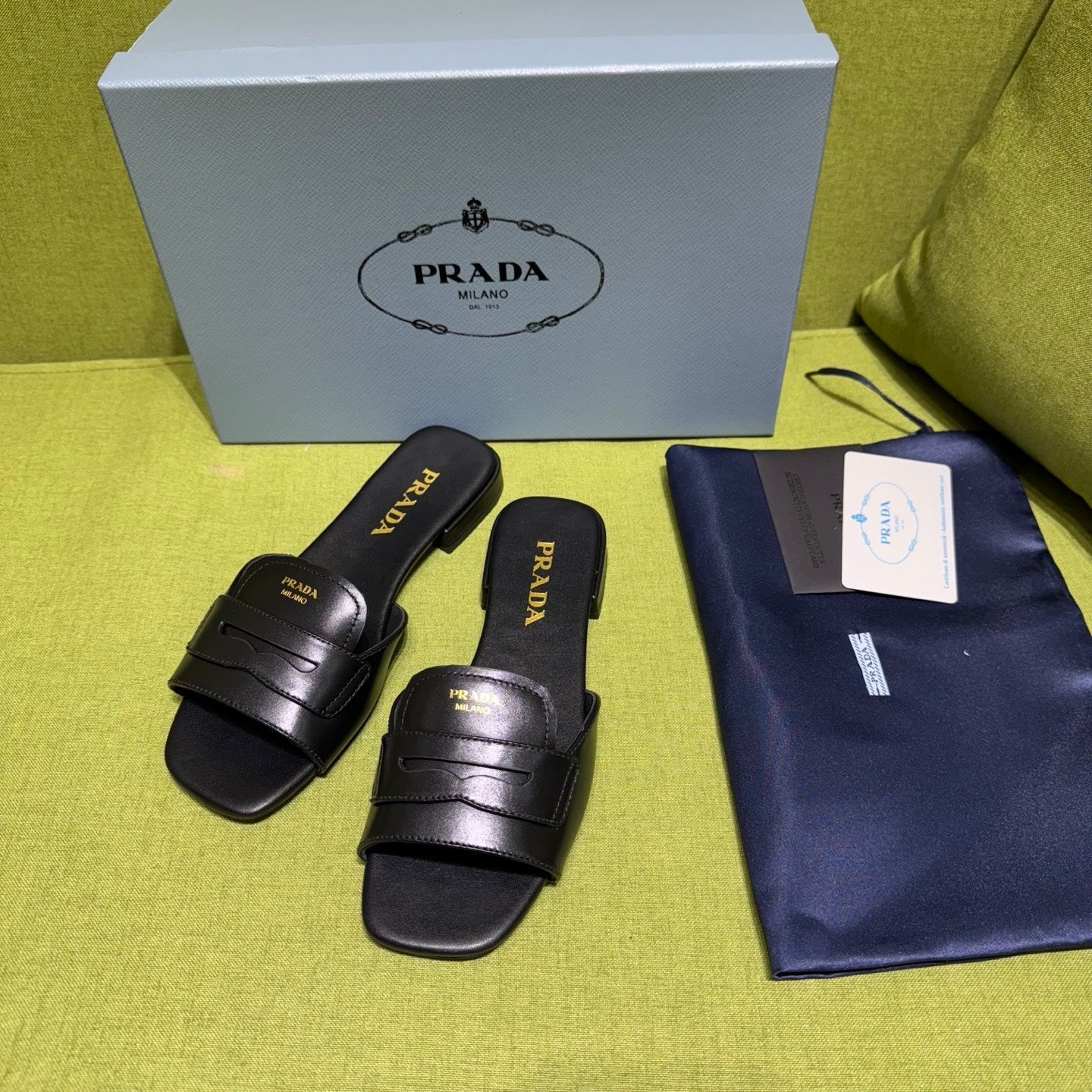 PRADA 25S SLIDES IN BLACK CALFSKIN