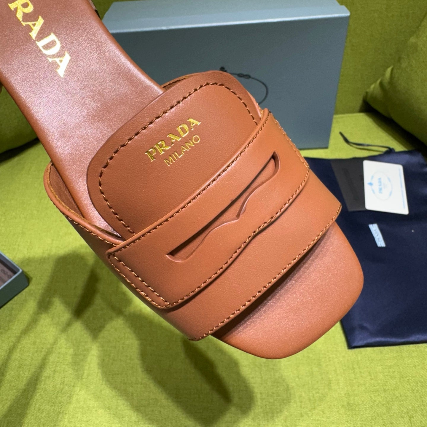 PRADA 25S SLIDES IN BROWN CALFSKIN