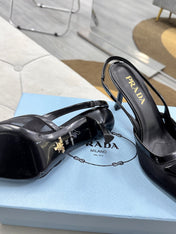 PRADA 25S TRIANGLE LOGO SLINGBACK PUMPS IN BLACK MESH FABRIC