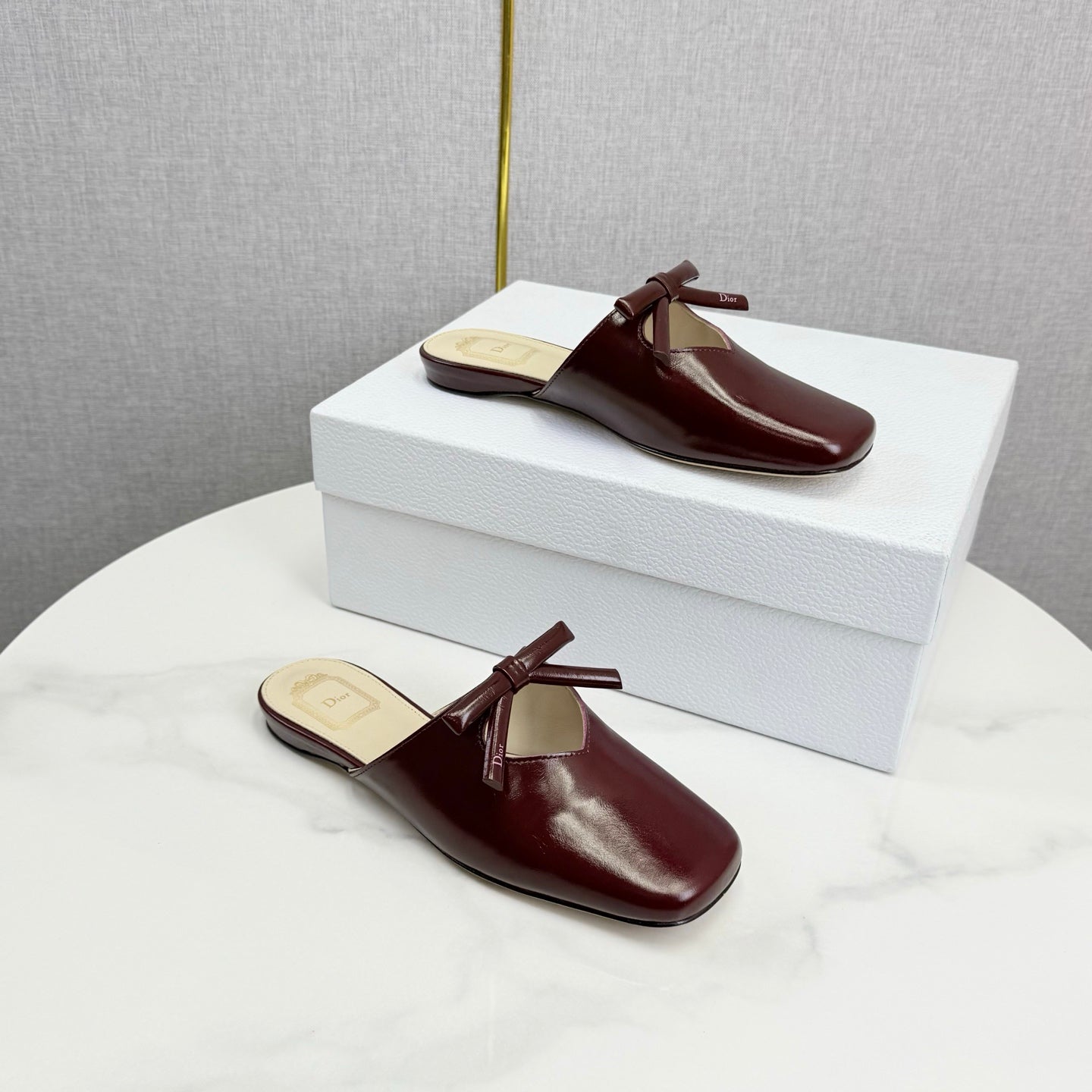 DIOR 26S PEARL-ACCENT BOW FLAT MULES IN DARK RED GLOSSY CALFSKIN