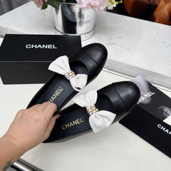 CHANEL 25S MARY JANES IN BLACK CALFSKIN WITH WHITE BOW GOLD HARDWRE