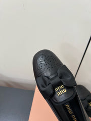 LOAFERS WITH BOW IN BLACK SHEEPSKIN