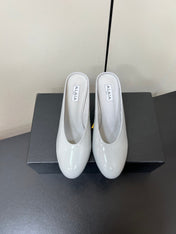 ALAIA WEDGE MULES 25S IN WHITE LAMBSKIN