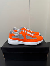 PRADA 26S SNEAKERS IN ORANGE PATENT CALFSKIN AND WHITE MESH