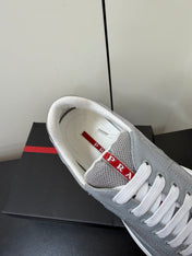 PRADA 26S SNEAKERS IN LIGHT GRAY PATENT CALFSKIN AND WHITE MESH