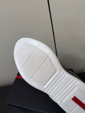 PRADA 26S SNEAKERS IN NAVY BLUE PATENT CALFSKIN AND WHITE MESH