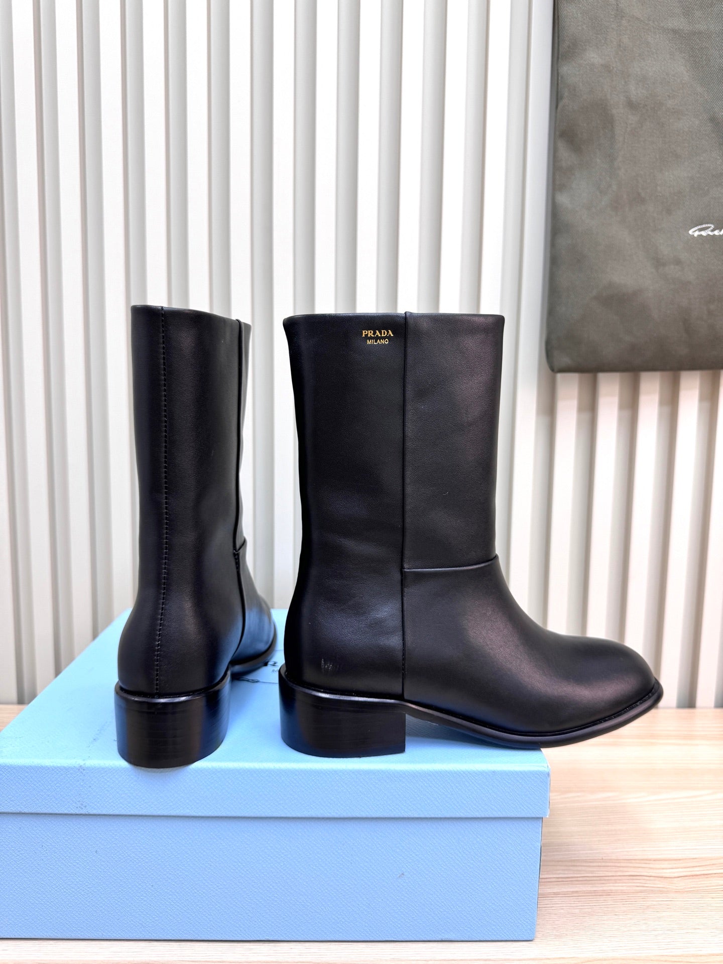 PRADA 25S LOW-CUT BOOTS IN BLACK LAMBSKIN