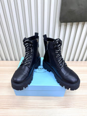 PRADA 25S MONOLITH BOOTS IN BLACK CALFSKIN