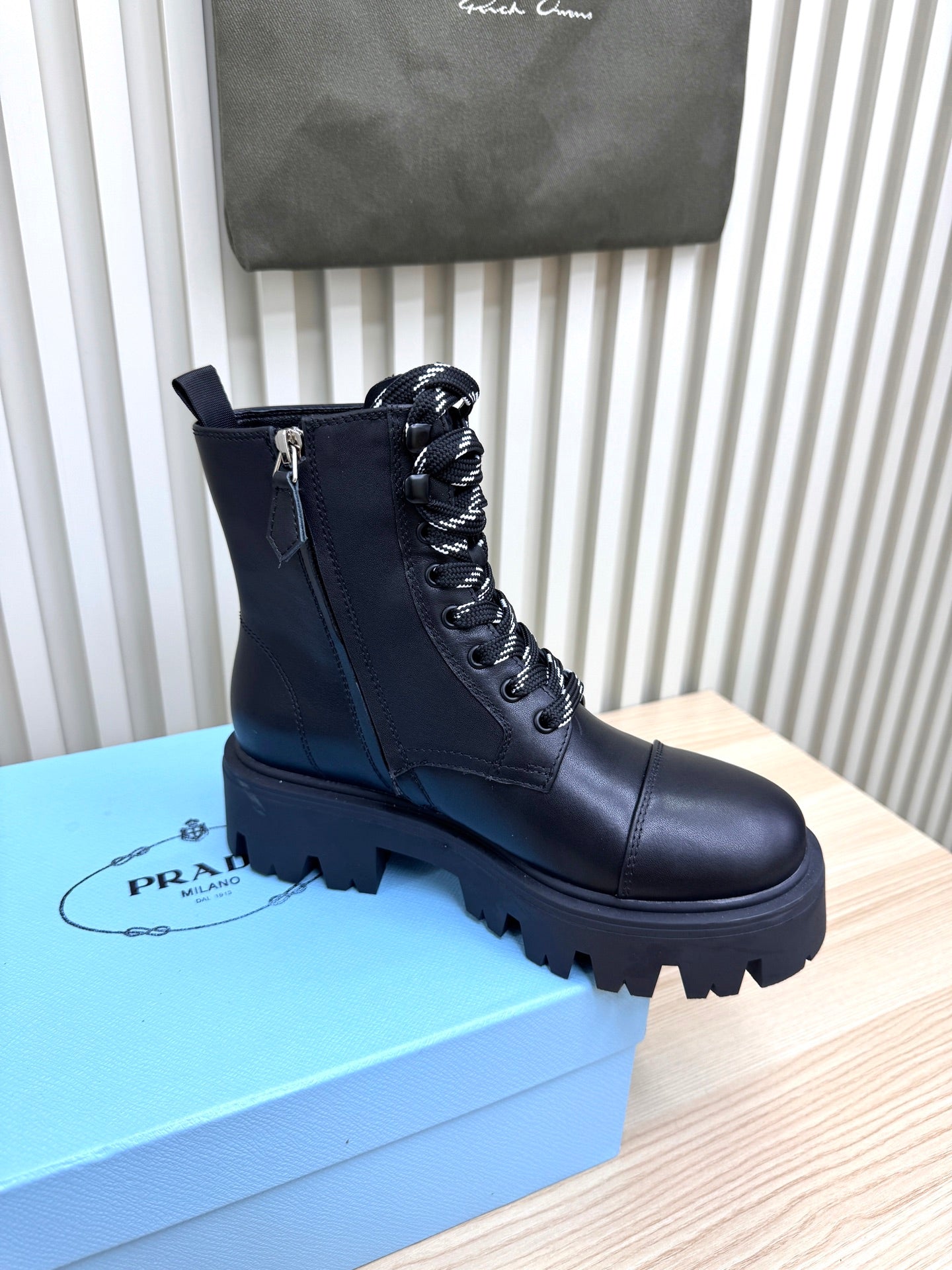PRADA 25S MONOLITH BOOTS IN BLACK CALFSKIN