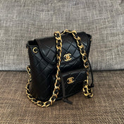 CHANEL 26S BACKPACK WITH FRONT POCKET 21 IN BLACK QUILTED LAMBSKIN GOLD HARDWARE