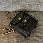 CHANEL 26S BACKPACK WITH FRONT POCKET 21 IN BLACK QUILTED LAMBSKIN GOLD HARDWARE