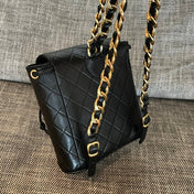 CHANEL 26S BACKPACK WITH FRONT POCKET 21 IN BLACK QUILTED LAMBSKIN GOLD HARDWARE