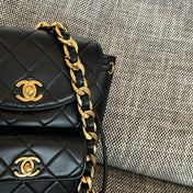 CHANEL 26S BACKPACK WITH FRONT POCKET 21 IN BLACK QUILTED LAMBSKIN GOLD HARDWARE