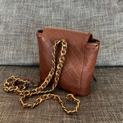 CHANEL 26S BACKPACK WITH FRONT POCKET 21 IN BROWN QUILTED LAMBSKIN GOLD HARDWARE
