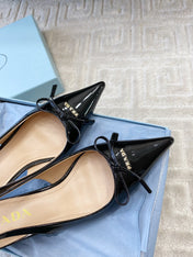 SLINGBACK PUMPS ATTACHED BOW IN BLACK GLOSSY CALFSKIN