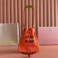 MIUMIU 26S WANDER BUCKET BAG 23 IN ORANGE RAFFIA WITH LEATHER TRIM