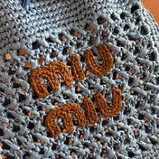 MIUMIU 26S WANDER BUCKET BAG 23 IN BLUE RAFFIA WITH LEATHER TRIM