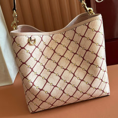 GUCCI 26S GG EMBLEM BUCKET BAG 25 IN LIGHT PINK COATED FABRIC