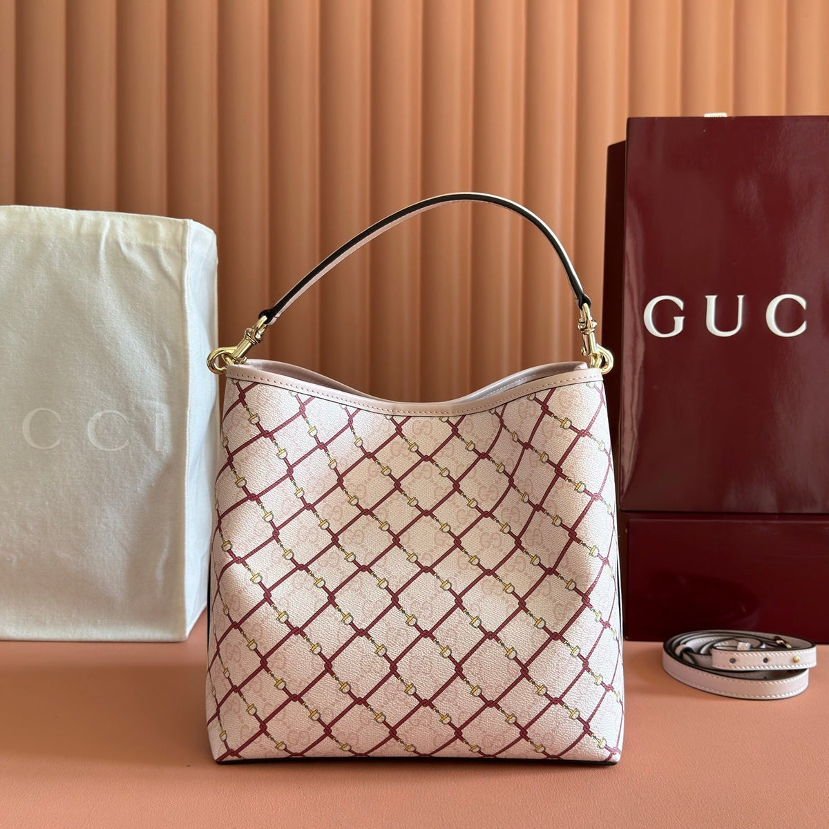 GUCCI 26S GG EMBLEM BUCKET BAG 25 IN LIGHT PINK COATED FABRIC