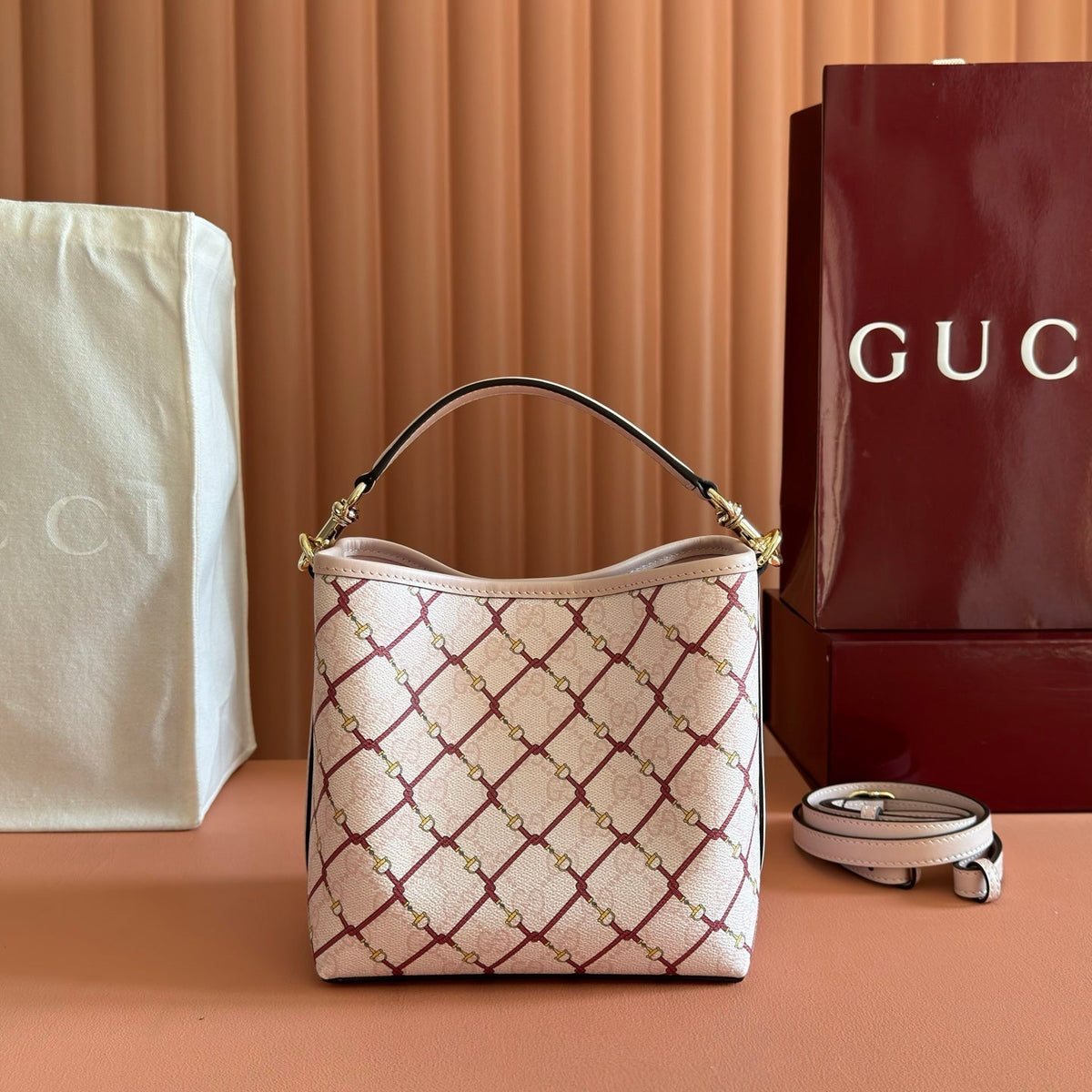 GUCCI 26S GG EMBLEM BUCKET BAG 19 IN LIGHT PINK COATED FABRIC