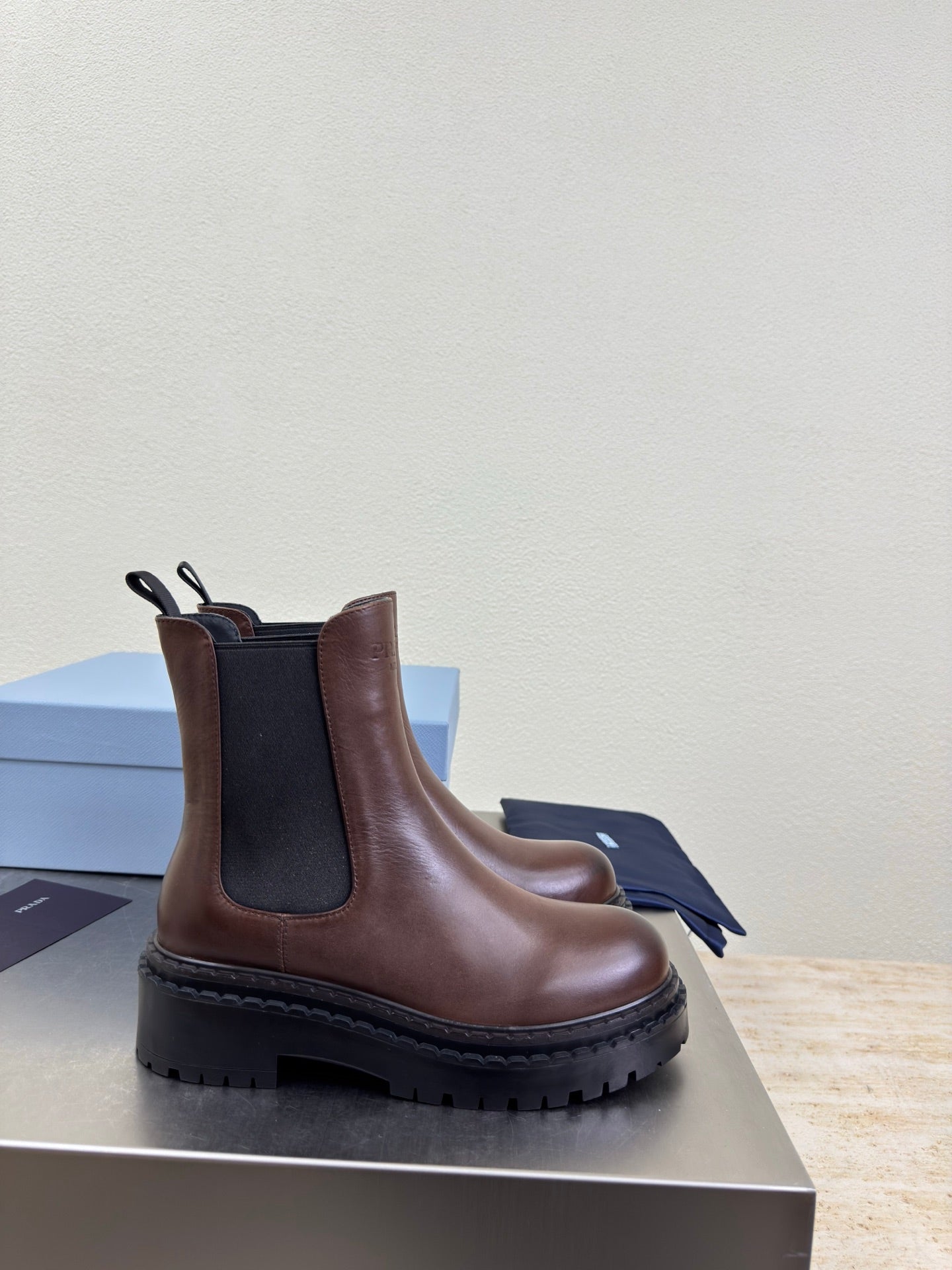 PRADA 25S PLATFORM CHELSEA BOOTS IN DARK BROWN CALFSKIN