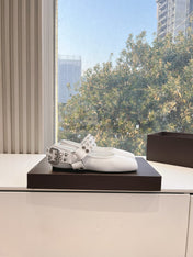 ALAIA 26S FLATS IN WHITE CALFSKIN WITH SILVER STUD STRAP