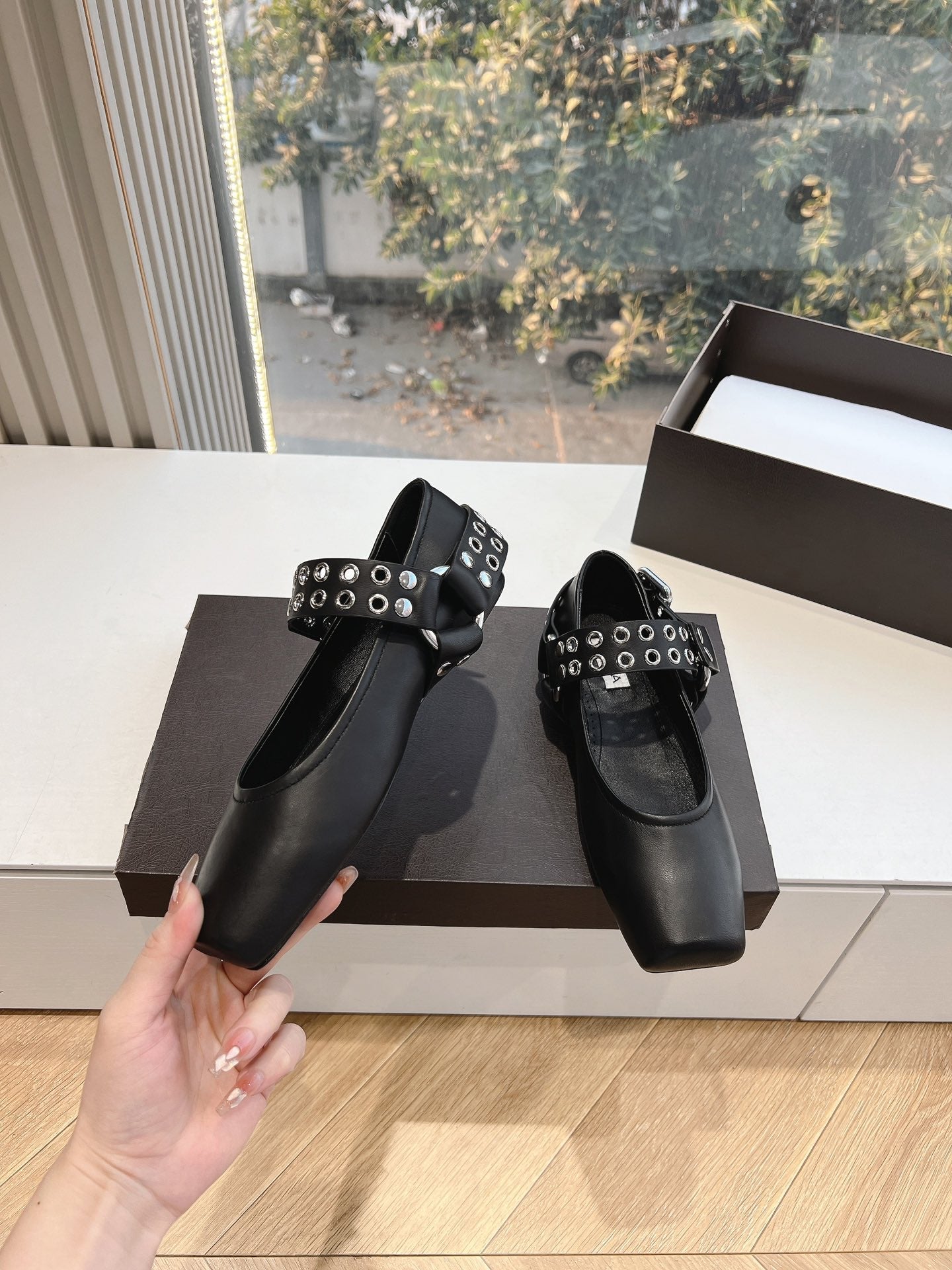 ALAIA 26S FLATS IN BLACK CALFSKIN WITH SILVER STUD STRAP