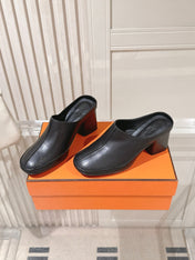 HM 26S HEEL MULES 65 MM IN BLACK CALFSKIN