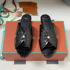 FLAT SLIPPERS IN BLACK CALFSKIN SNAKE EMBOSSING
