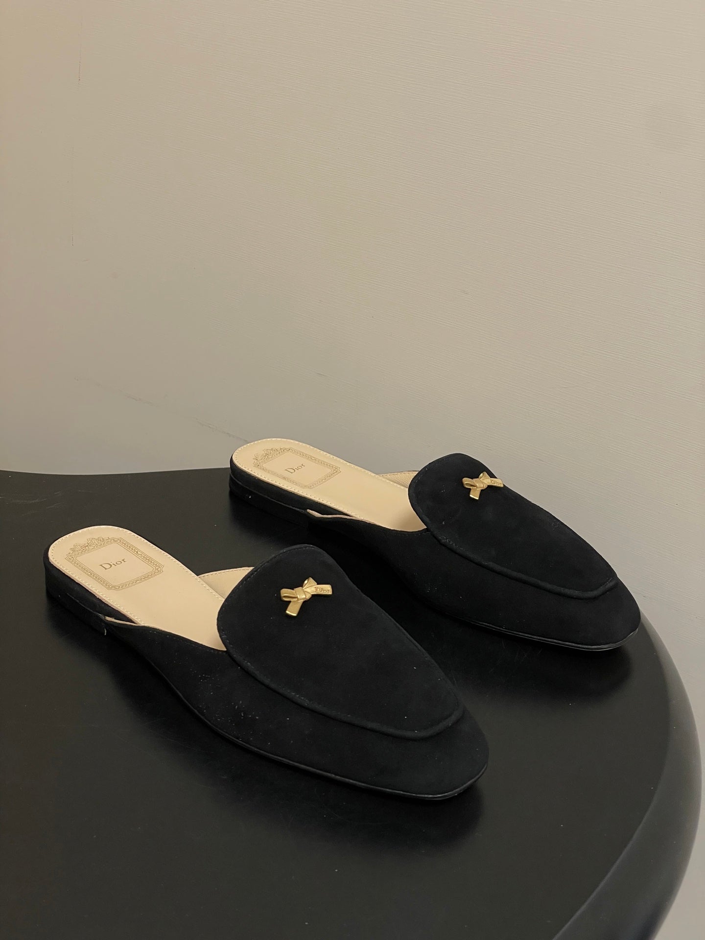 DIOR 26S MULES IN BLACK SUEDE WITH BOW