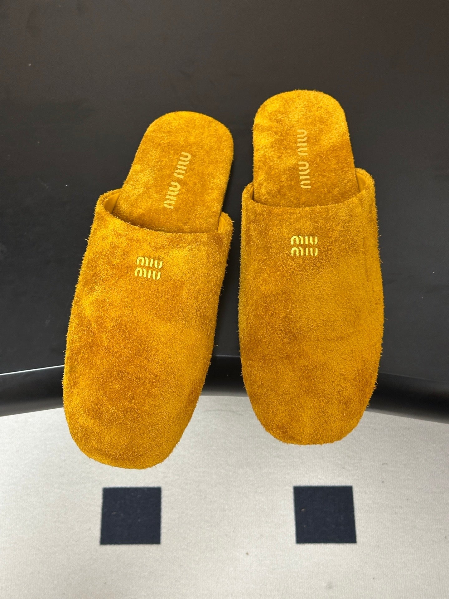 MIUMIU 26S MULE LOAFERS IN OCHRE YELLOW SUEDE LOGO