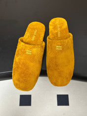 MIUMIU 26S MULE LOAFERS IN OCHRE YELLOW SUEDE LOGO