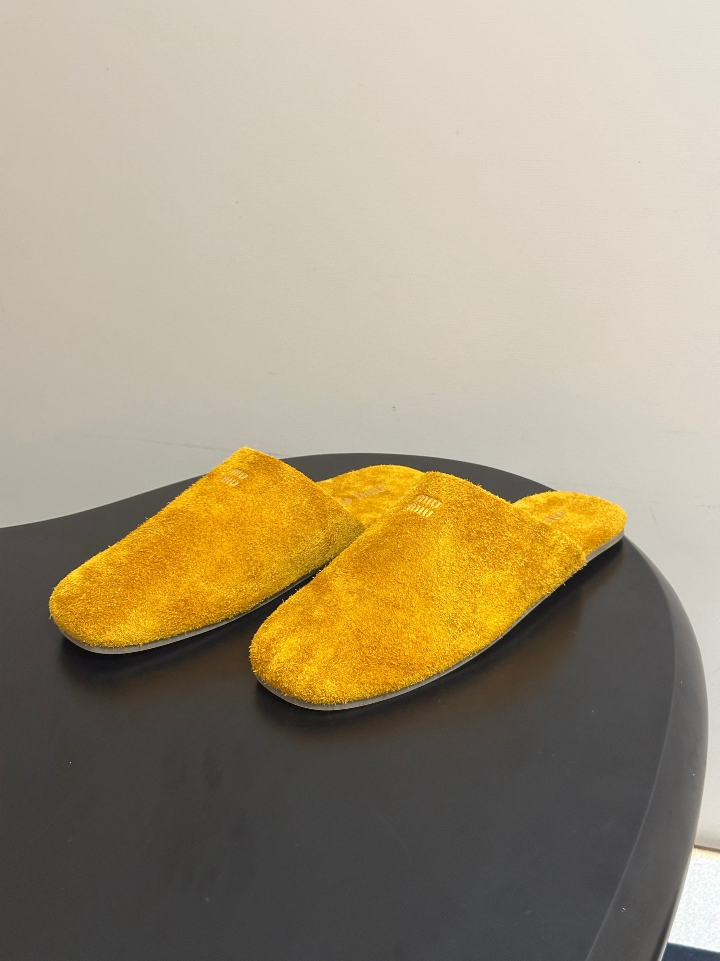 MIUMIU 26S MULE LOAFERS IN OCHRE YELLOW SUEDE LOGO