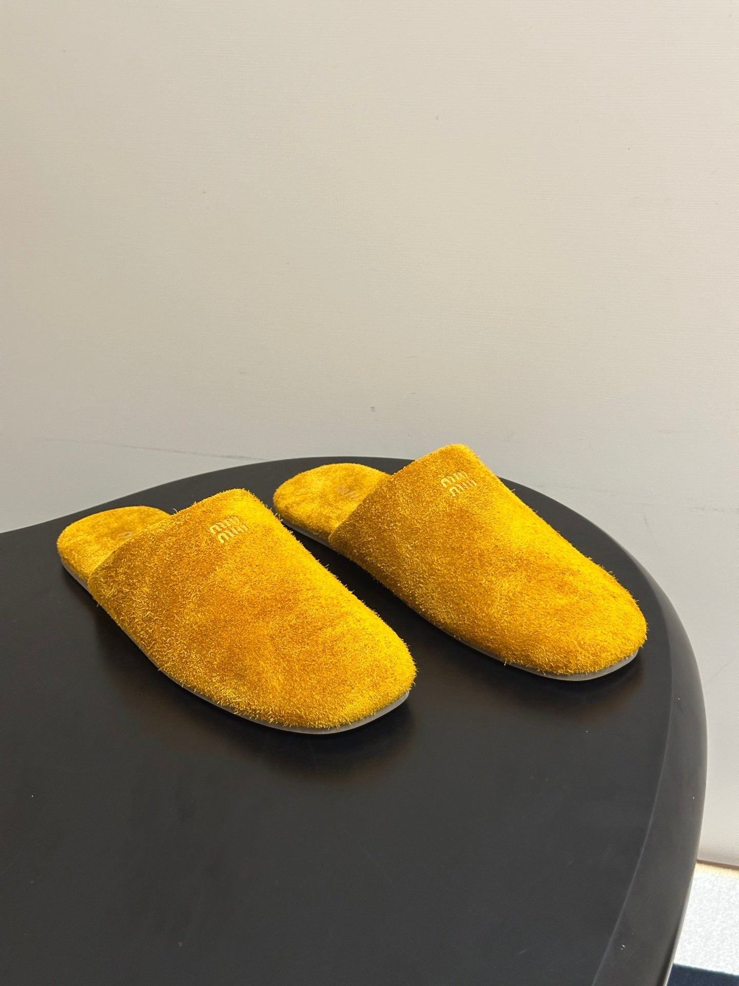 MIUMIU 26S MULE LOAFERS IN OCHRE YELLOW SUEDE LOGO