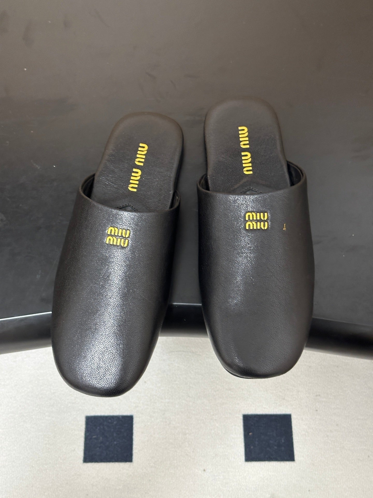 MIUMIU 26S MULE LOAFERS IN BLACK CALSKIN